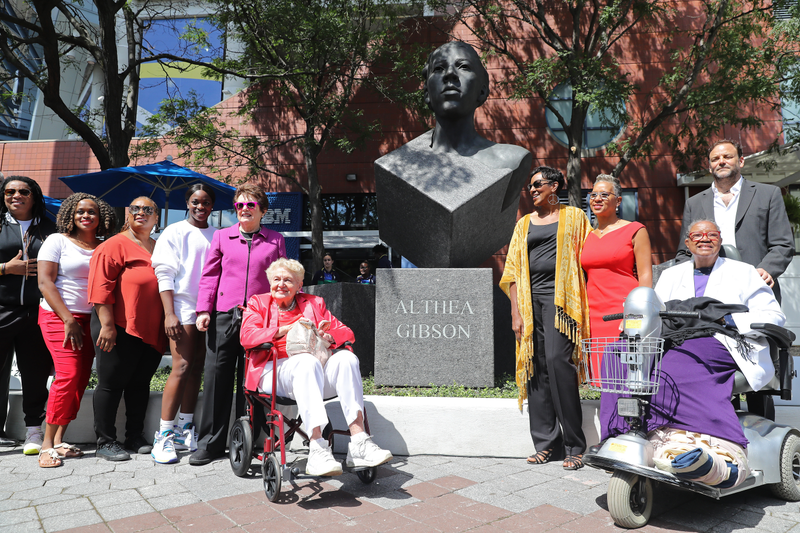Players and dignitaries pose for a photo with the statue during the unveiling ceremony of the Althea Gibson sculpture on day one of the 2019 US Open at the USTA Billie Jean King National Tennis Center on August 26, 2019, in the Flushing neighborhood of the Queens borough of New York City.